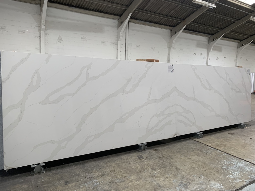 Calacatta Gold Classic Quartz video thumbnail — bright white base with grey veins and golden highlights